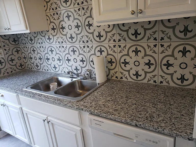 All updated new cabinets, granite, sink, garbage disposal and backsplashh. New faucet was installed after this photo.