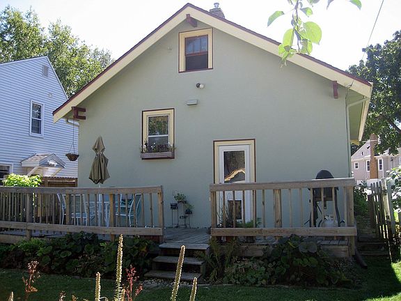 back of house with large deck