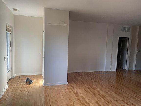 Entrance with door facing a spacious entrance closet for shoes and coats