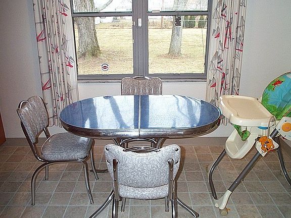 Sunlit dinette views fenced rear yard