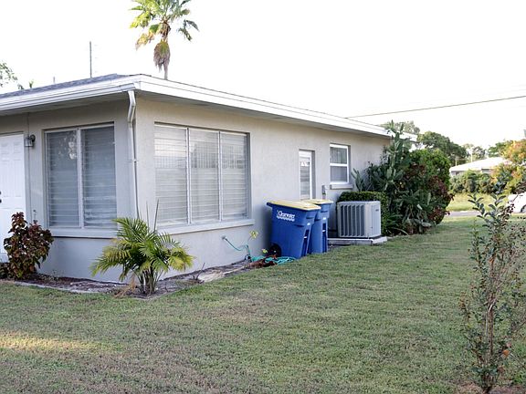 Rear and side of house. Door leads to the bonus room.