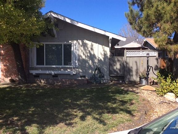 Front of Duplex and side Patio, front yard.