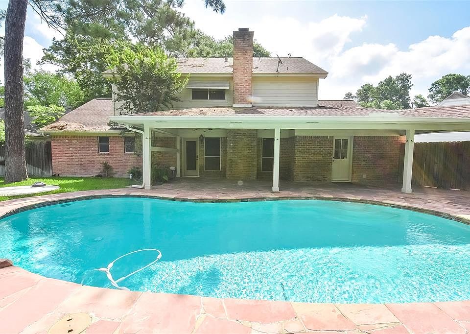 The beautiful pool with waterfall and covered patio area will be your "go to" place this summer!