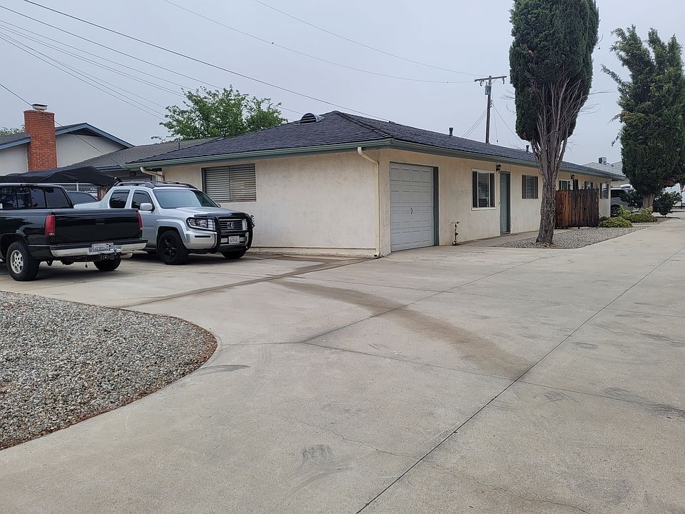Side of unit and two parking spaces.