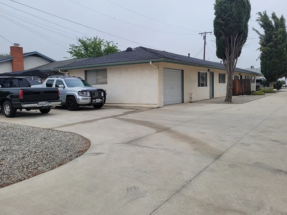 Side of unit and two parking spaces.