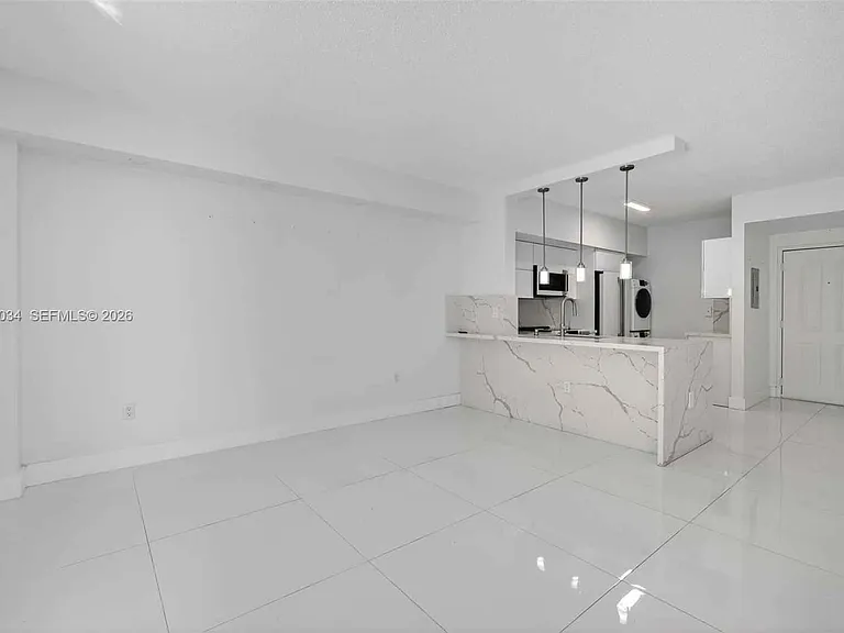 5077 NW 7th St — Photo 2