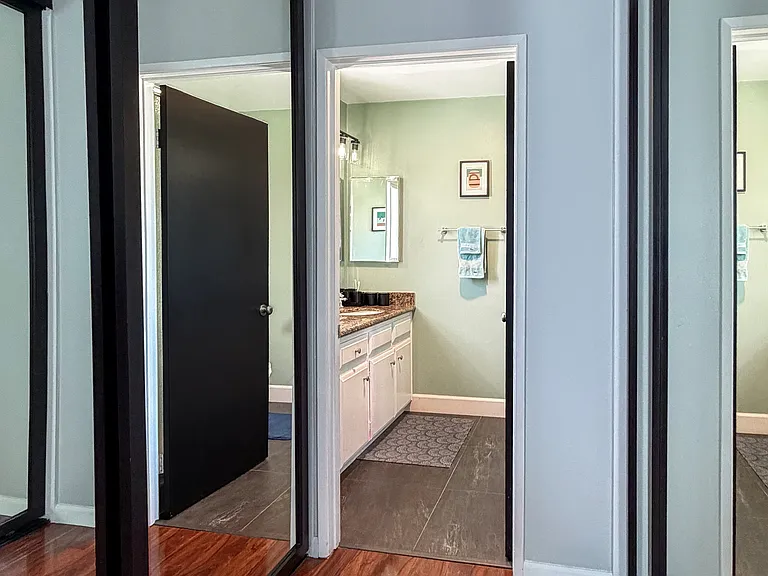 Spacious primary suite with mirrored closets