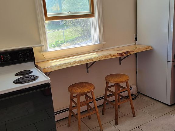 live edge breakfast bar and extra counter space in galley kitchen