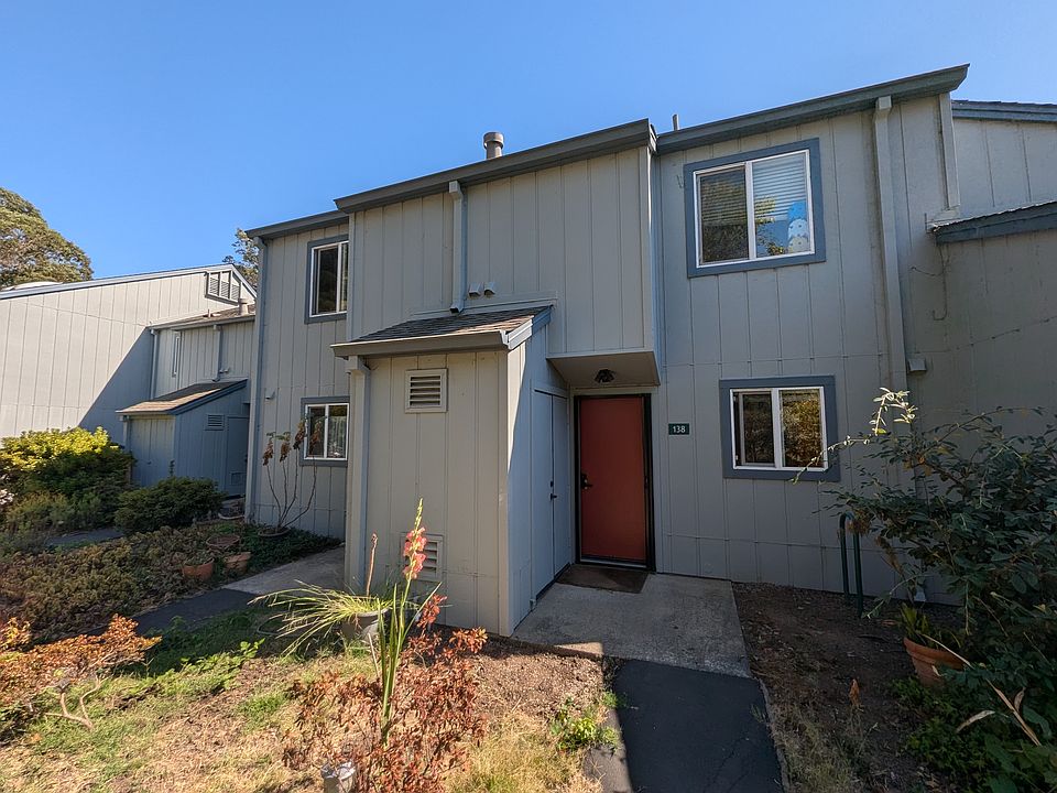 Front door, water heater closet, and second bedroom window