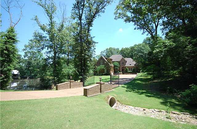 Great view of the wooden lot and private lake.