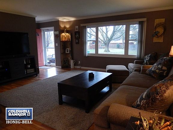 Living Room.  Refurbished hardwood floors. Triple pane easy clean front window.  Freshly painted.