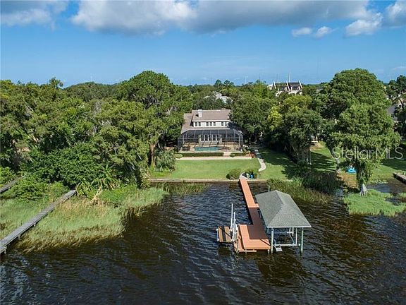 Nestled among lush landscape where nature provides the privacy you desire!