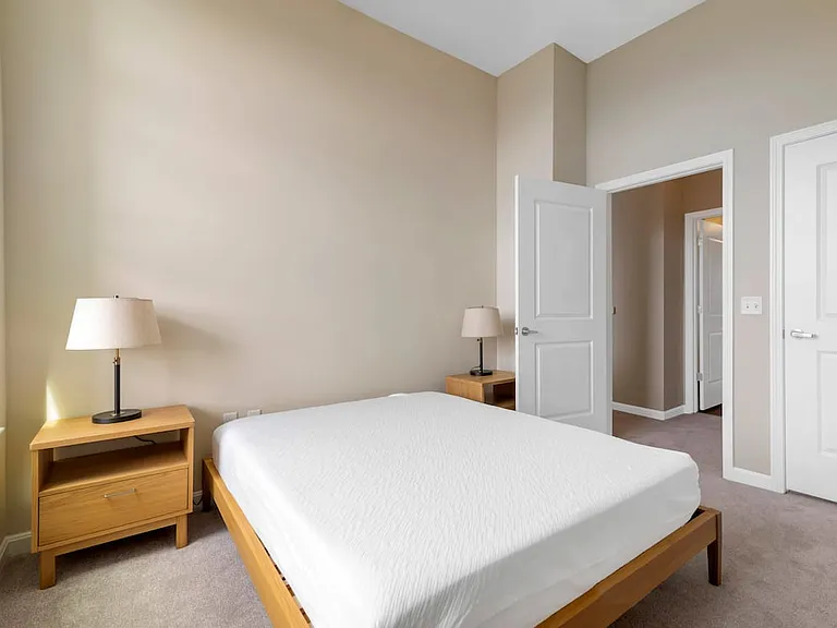 Furnished+ apartment homes feature queen bed with mattress, dresser, nightstands, and lamps (Representative Image exact items and style of furnishings may vary)