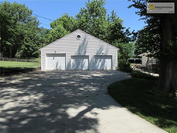 Three car garage with concrete floor, heat, and electricity.  Siding matches the house.  Side door for entry.