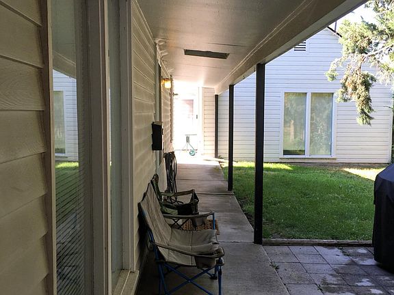 Covered walkway from parking to front door. Also view of second home on the rear of the property