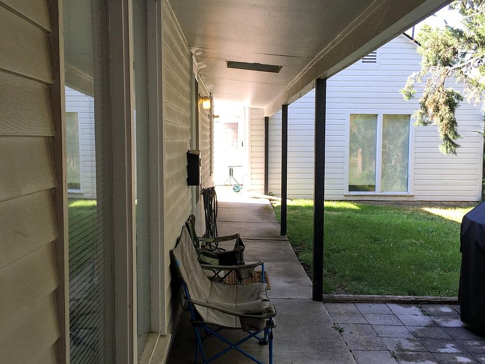 Covered walkway from parking to front door. Also view of second home on the rear of the property