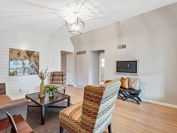 You will love the vaulted ceiling in the living room when you walk in and the shiplap accent wall!