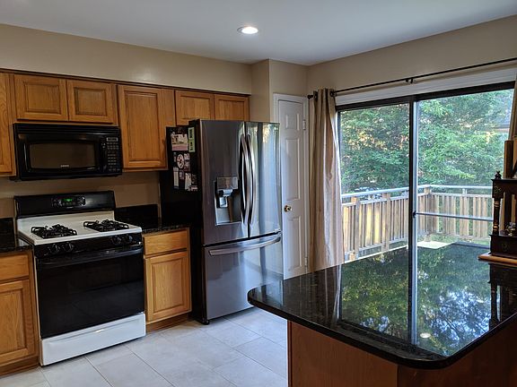 Kitchen w/ brand new fridge