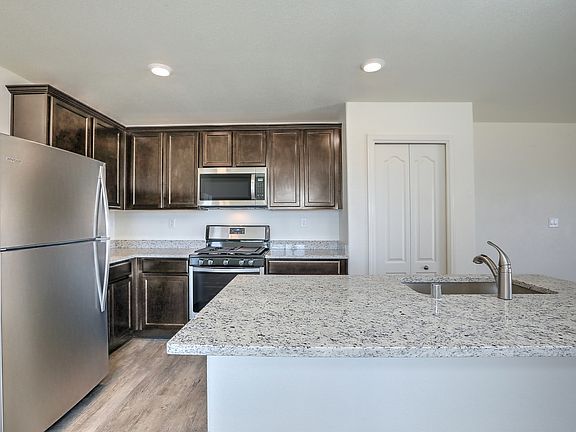 Chef-ready kitchen with stainless appliances and granite countertops.
