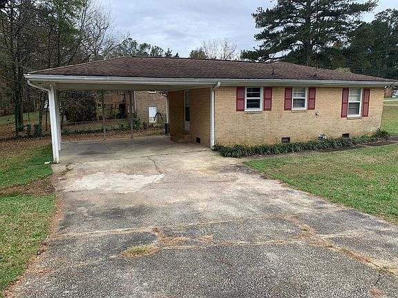 side of the house, carport view