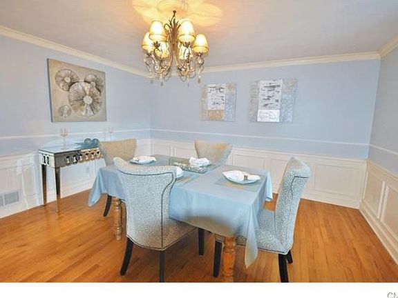 Formal dining room adjacent to kitchen creates an easy flow for entertaining.
