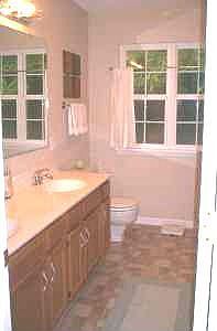 Large master bath with extra long vanity and large garden tub.