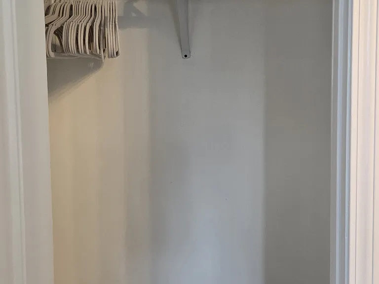 Closet for additional storage. Includes clothing steamer