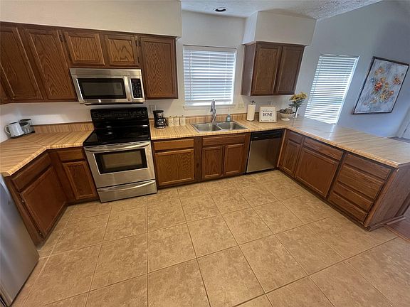 4th image of 13930 Old Village Ln