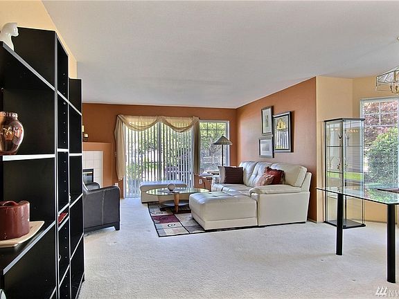 Enter into the spacious Open-Plan Living, Dining room with wood burning Fire Place and outdoor Patio.