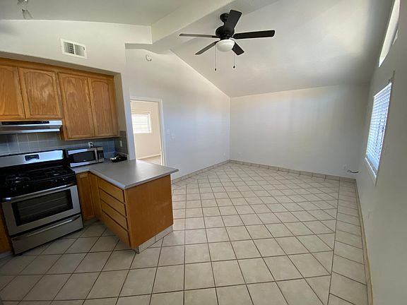 From the front door, facing the kitchen and living room.