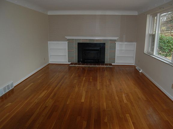 Large living room with fireplace.