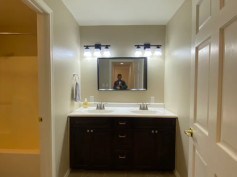 bathroom with dual sinks