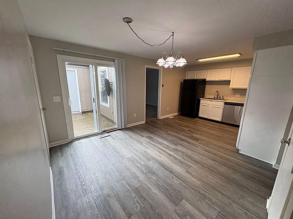 Open kitchen and dining room area to the private porch with 27" TV