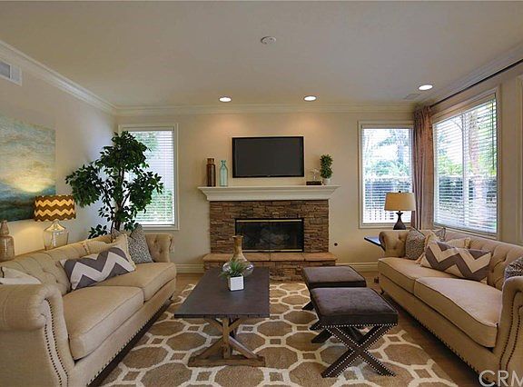 This is the comfortable family room that is close to the kitchen with cozy fireplace.