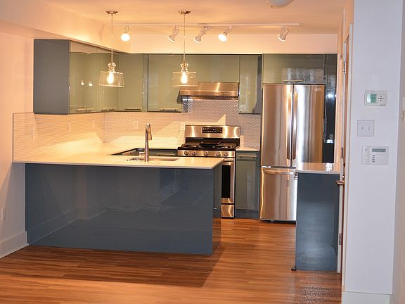 Kitchen with countertop dining - walk-in utility close with W/D in far right corner