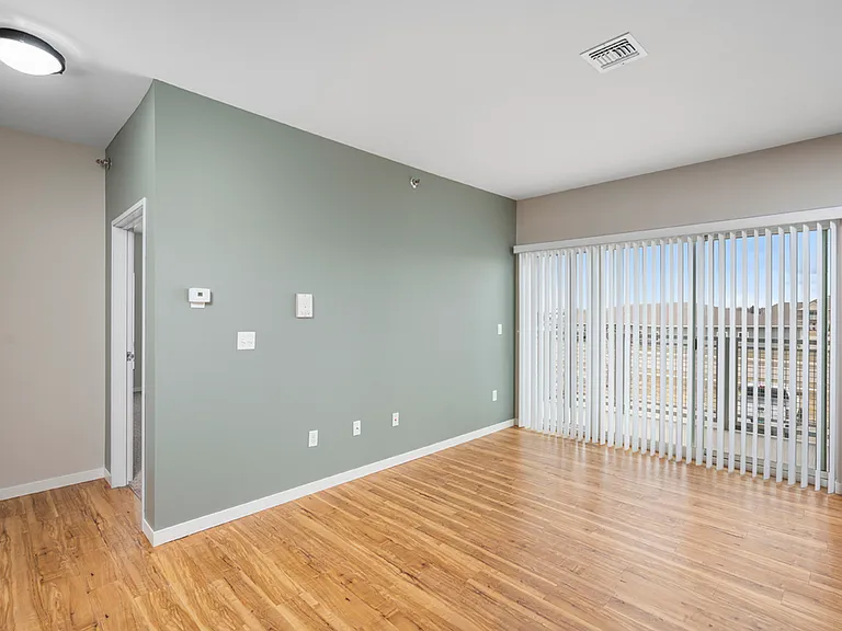 Bright modern living space with elegant wooden flooring and large windows, perfect for natural light. Bright modern living space with elegant wooden flooring and large windows, perfect for natural light.