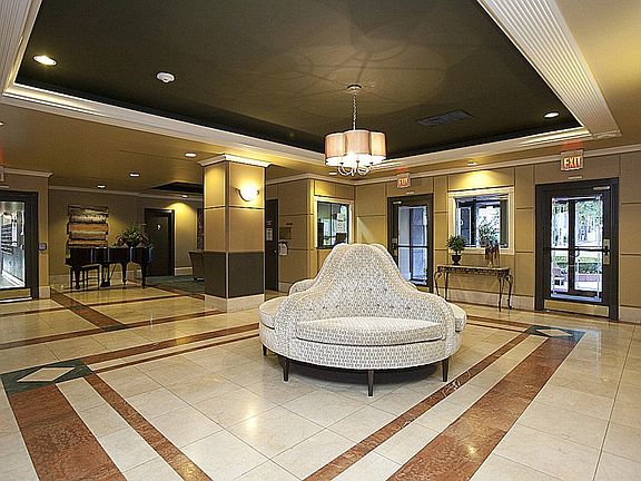 The lobby welcomes guests with a chic sense of style. Only residents have access to the building.