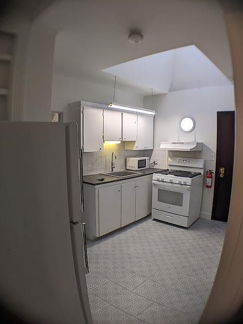 Kitchen view, (from bedroom).