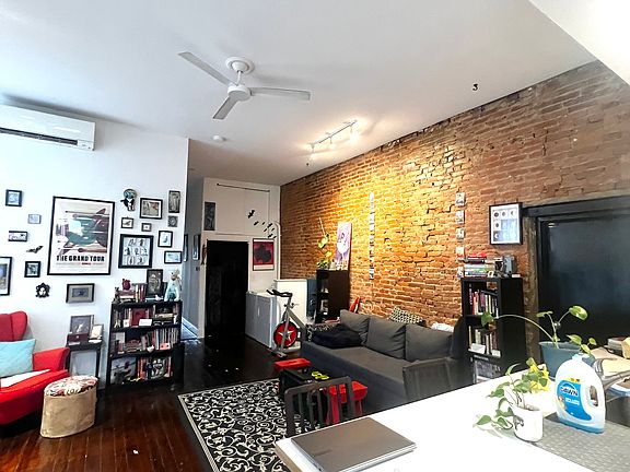 Living room (high ceilings) 
Exposed brick
Hardwood floors
