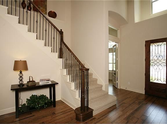Hardwood floors grace the entry, formal dining, study, den and kitchen in this home.