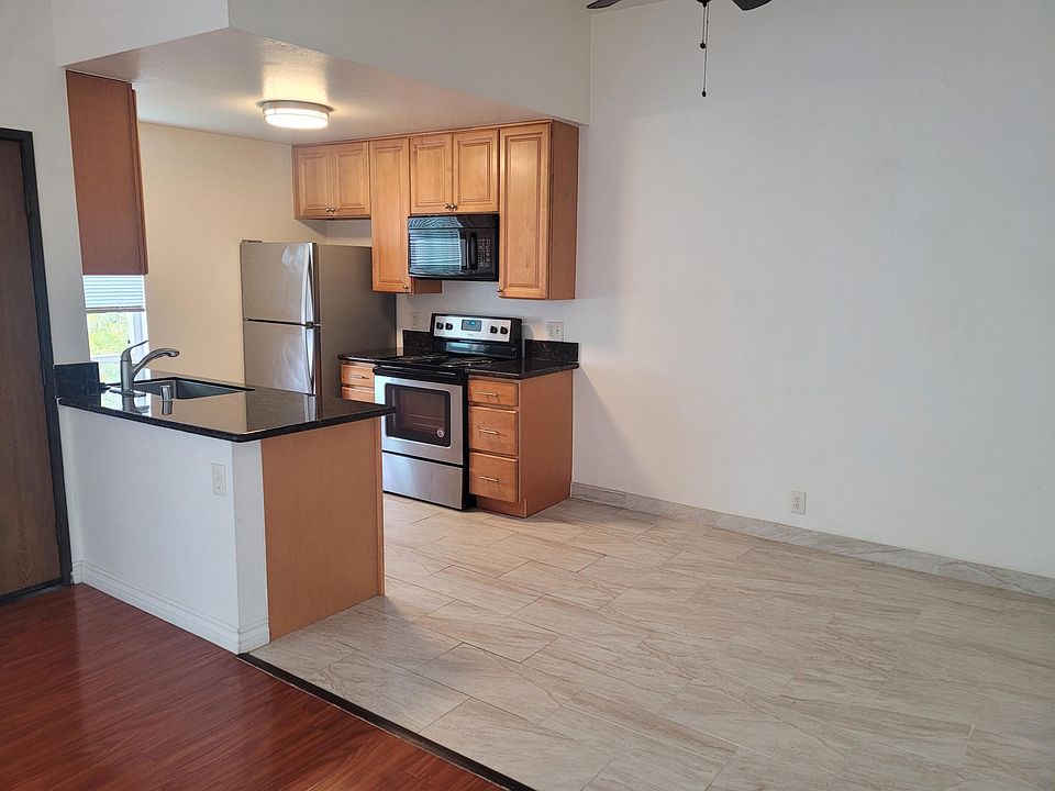Open Kitchen with dining area. Top floor bright sun lit room with vaulted ceilings.