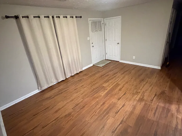 Living room towards front door and hallway