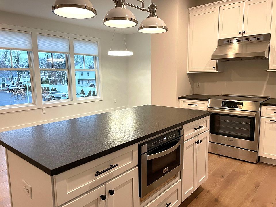 Large center island kitchen with room for stools. Granite counters.