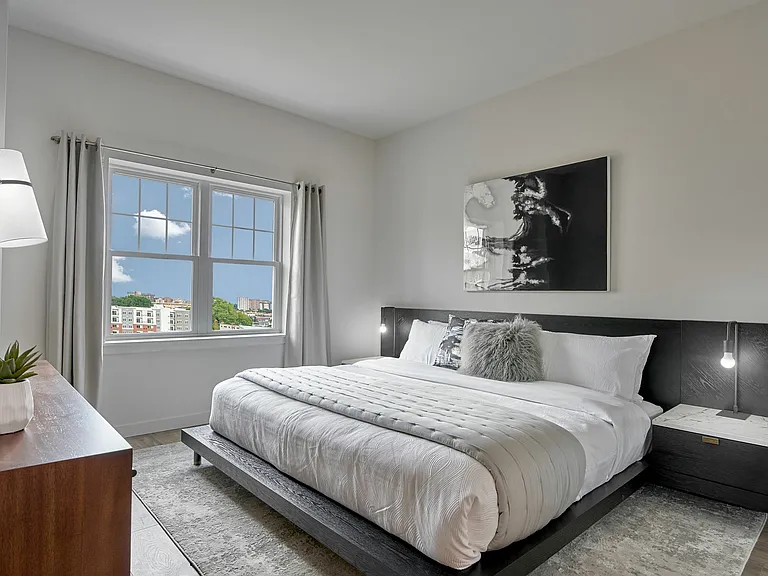 Experience tranquility in this inviting bedroom, designed to offer comfort and style.