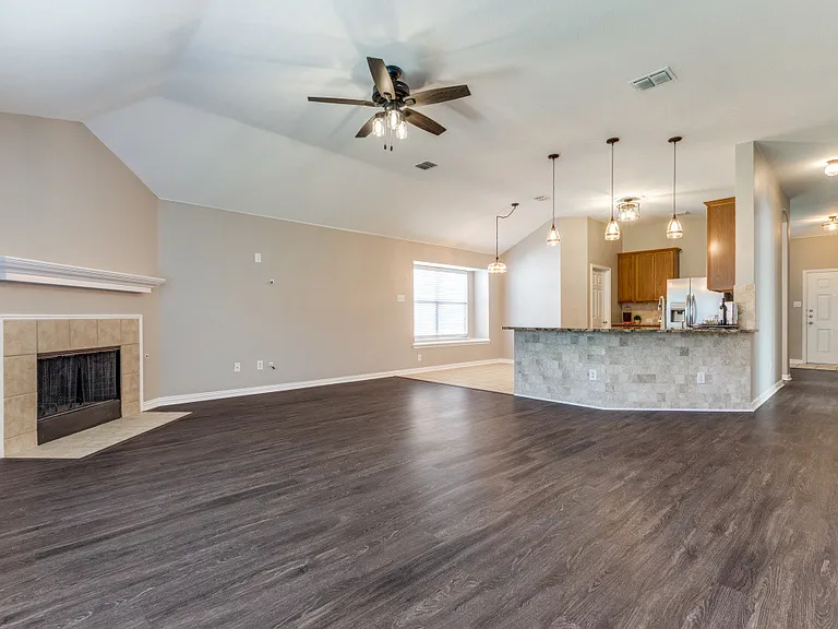 From Primary bedroom overlooking the living room, breakfast nook, kitchen all the way down the hall to the front door.