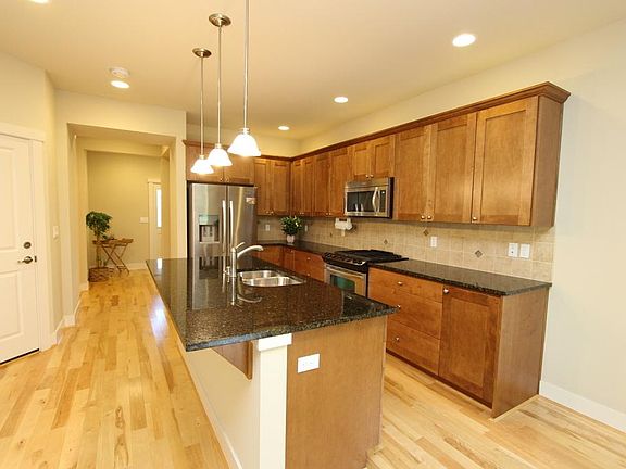 Gorgeous cherry kitchen in open concept to large adjoining dining area and family room. Pantry also.
