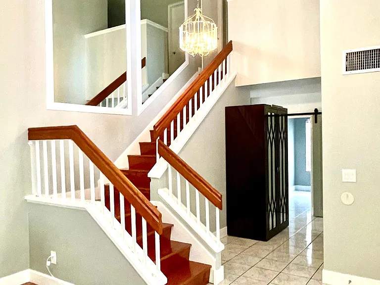 Entry and stairs, living room and hard wood floors and tile throughout.