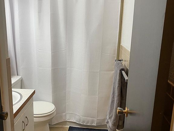 Full bathroom with linen closet.