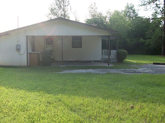 side view of the house & car
