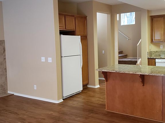 New flooring and kitchen countertops. New fireplace surround.
